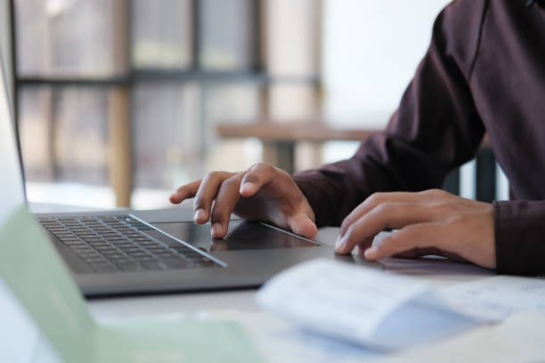 istock Accountant filling in items from a bill and use computers to calculate financial budgets 2143307668