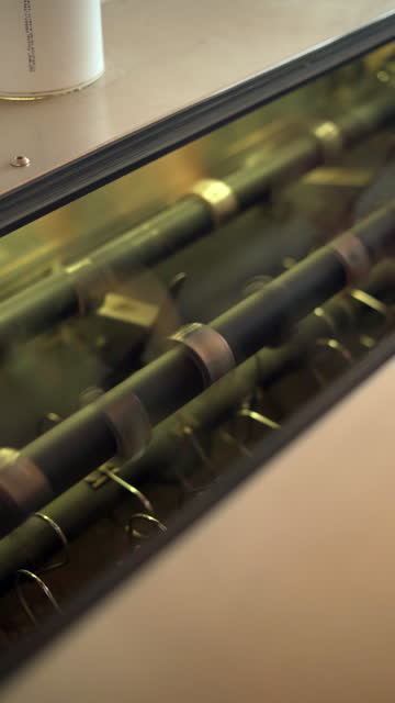 Close-up of a carpet beating system in a professional machine at a carpet cleaning service