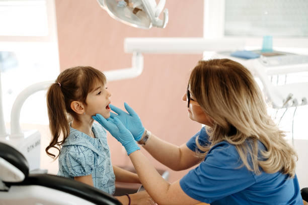 istock The girl at the dentist 2143378372