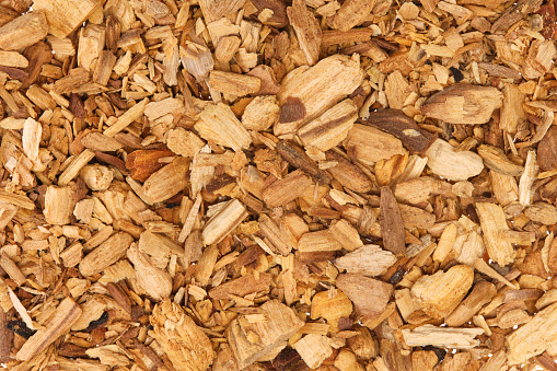 Palo Santo chips (Bursera graveolens), also known as holy wood. Close-up, table top view, format-filling.