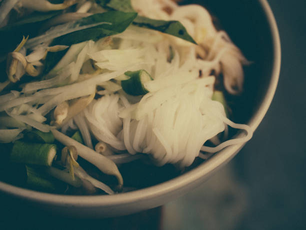 eating noodles with fish and shrimp or shrimp and fish noodles or Chinese noodles or seafood noodle