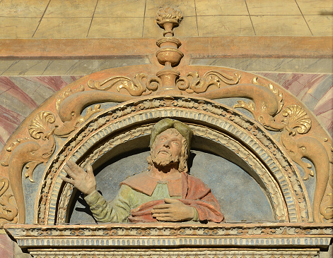 Detail of the decorated entrance portal to the Cathedral of Santa Maria Assunta of Aosta comes from the V-XIX century, the Valley of Aosta, north of Italy