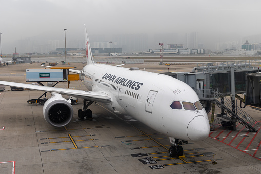 Hong Kong - March 18, 2024 : Japan Airlines Boeing 787-8 Dreamliner at the Hong Kong International Airport.