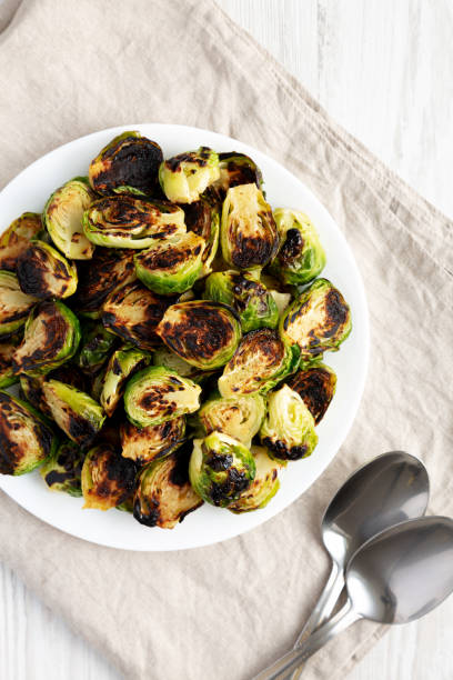 istock Homemade Roasted Brussel Sprouts on a Plate, top view. Flat lay, overhead, from above. 2143435556