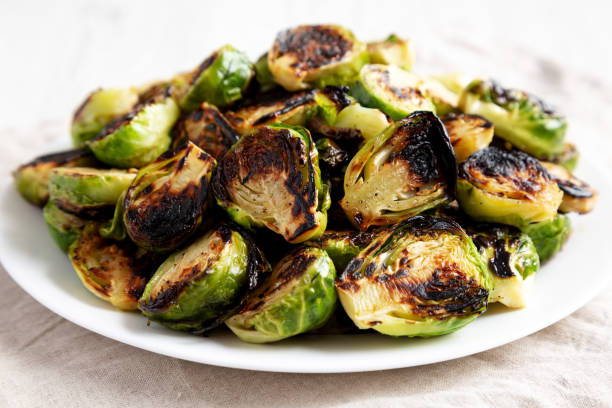 istock Homemade Roasted Brussel Sprouts on a Plate, side view. 2143436085