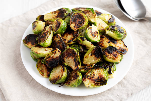istock Homemade Roasted Brussel Sprouts on a Plate, side view. 2143436140