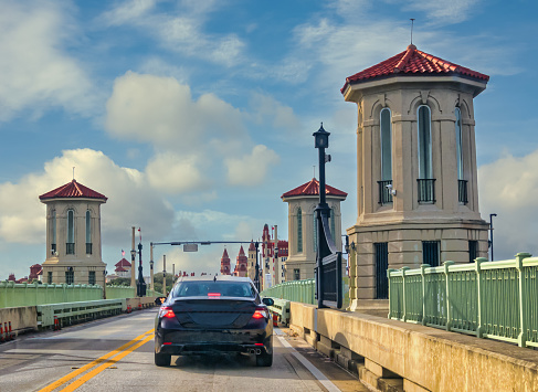 Vehicular traffic drives over the Intracoastal Waterway on the famous Bridge of Lions drawbridge, heading toward downtown St. Augustine, Florida