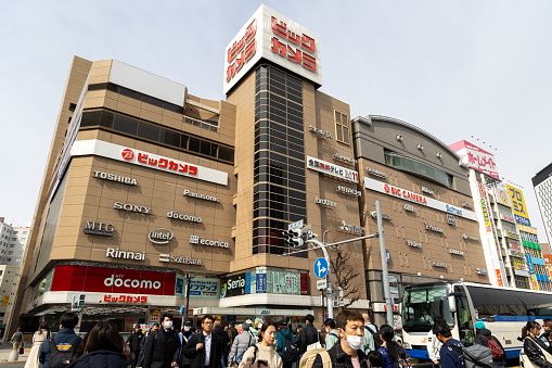 Nagoya, Japan - March 19, 2024 : Pedestrians walk past the Bic Camera in Nagoya, Japan. Bic Camera is a famous electronics retailer chain in Japan.