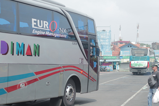 Bandung, Indonesia - April 4 2024: The bus was parked at the Cicaheum terminal waiting for passengers who would board at their destination during the day.