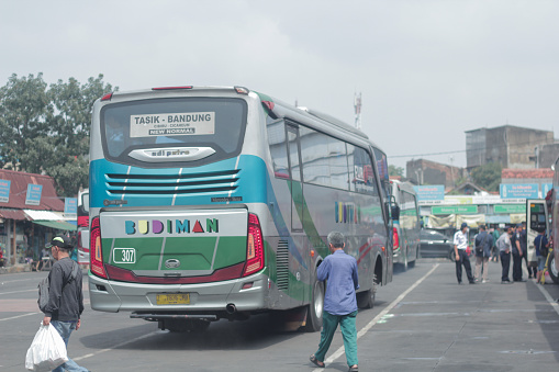 Bandung, Indonesia - April 4 2024: The bus was parked at the Cicaheum terminal waiting for passengers who would board at their destination during the day.