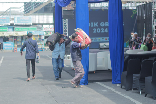 Bandung, Indonesia - April 4 2024: The bus was parked at the Cicaheum terminal waiting for passengers who would board at their destination during the day.