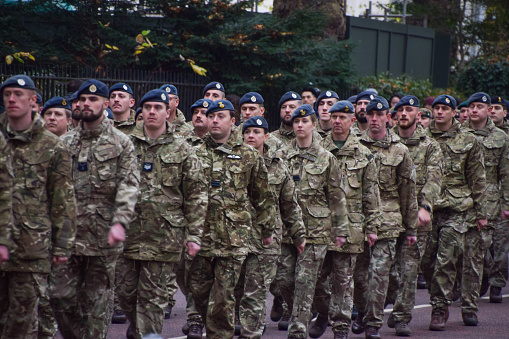 London, UK - November 24 2021: members of the UK Armed Forces march in London during a parade.