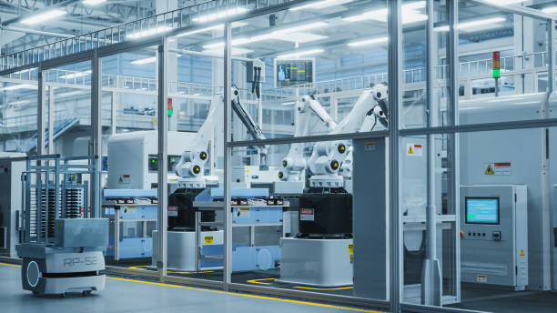 istock 3D Render Of Electronics Components Manufacture: Automated Robotic Arm Assembly Line in Futuristic Facility with Robots Producing Advanced High Tech Sustainable Parts for Information Technology. 2143485736