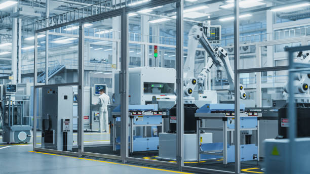 istock 3D Render Of Electronics Components Manufacture: Automated Robotic Arm Assembly Line in Futuristic Facility with Robots Producing Advanced High-Tech Sustainable Parts for Information Technology. 2143486250