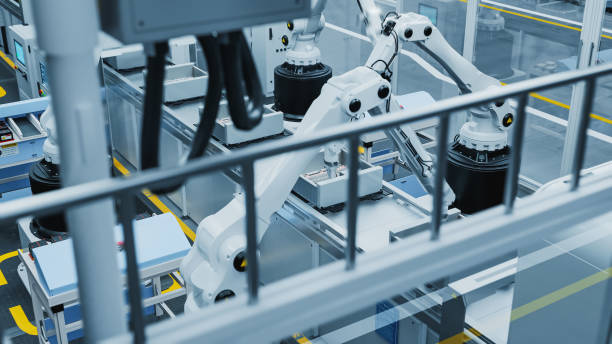 istock 3D Render of Electronics Factory: Automated Robot Arm Assembly Line Manufacturing Advanced Electronic Components for Different Industries. High Angle Overview of an Operating Conveyor Line Production 2143486261