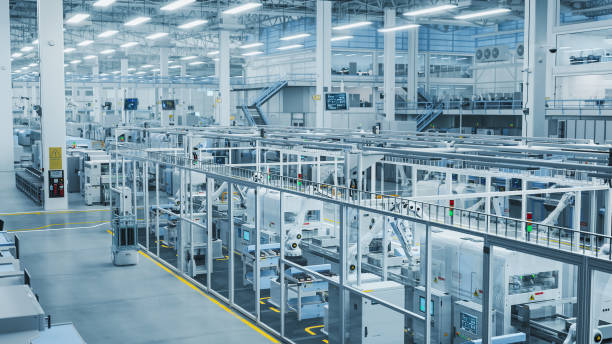 istock 3D Render: Advanced Robot Arm Conveyor Line Manufacturing Electronics Enclosure Boxes. High Angle Shot with Artificial Intelligence Assembly Line Building HighTech Products for the Technology Industry 2143488405