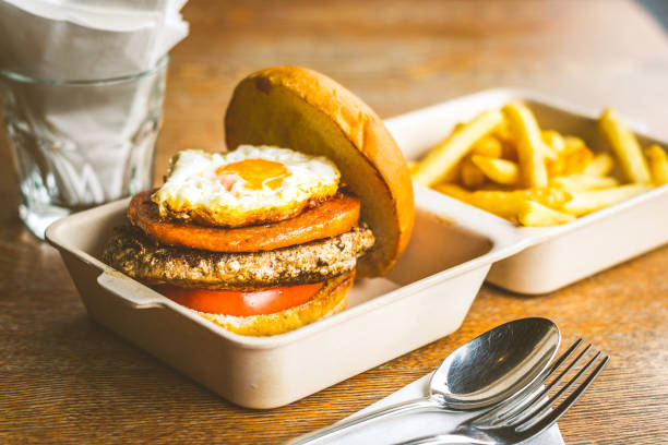 istock Champion Burger with Beef patty, chicken luncheon meet, sunny side up egg 2143495383