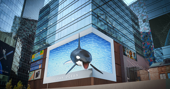 Big City 3D Advertising Billboard with Orca. Creative Clean Ocean Commercial with an Orca in a Modern Urban District with Skyscrapers. Futuristic Ad Concept with Stylish Realistic Display
