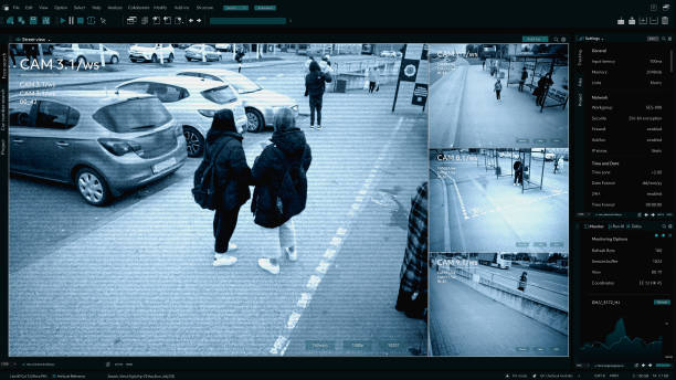istock CCTV AI Facial Recognition Camera Authentificating People on Street. Security Camera Surveillance Footage Identity Scanning Crowds of People Walking Safely on Big City Streets. Big Data AI Analysis 2143497534