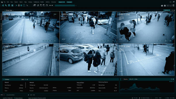 istock CCTV AI Facial Recognition Camera Authentificating People on Street. Security Camera Surveillance Footage Identity Scanning. Crowds of People Walking Safely on Big City Streets. Big Data AI Analysis 2143498084