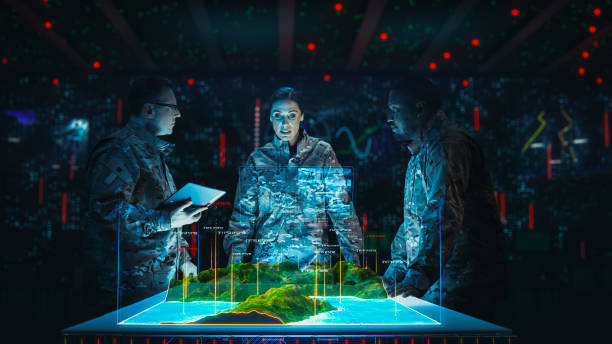 istock Futuristic Warfare Strategy: Military Intelligence Experts use Holographic Augmented Reality Table Map to Scan Enemy Position. Army Recoinessance Use 3D Surveillance Tech, Data Analysis to Win War 2143502312