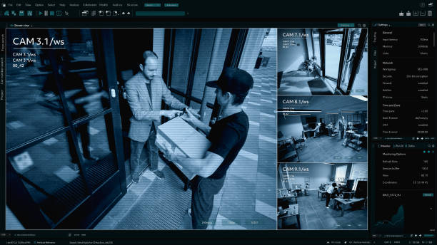 istock Surveillance Camera CCTV Footage, Multiple Screens Show Postal Package Delivery into the Office. High Tech Security and Data Protection Mock-up. Screen Replacement Template for Computer Displays 2143507636
