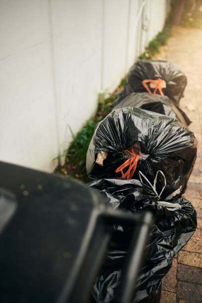 istock A stack of plastic garbage bags and rubbish bin. Copy space 2143553807