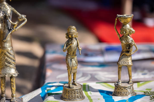A handmade brass idol of indian farmer from tribal area is a stunning piece of art that blends craftsmanship. Selected focus.