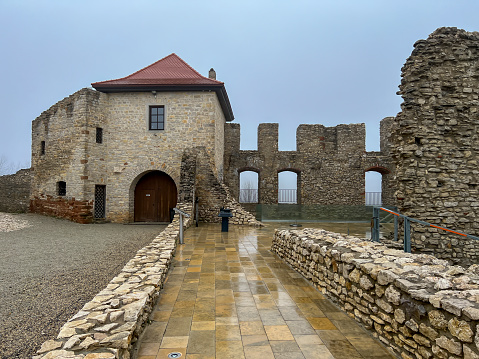 Castle ruins in Rabsztyn in Poland in rainy and foggy weather. The facility near Olkusz was partially rebuilt and made available on the Eagle's Nests trail on the Krakow-Czestochowa Upland.