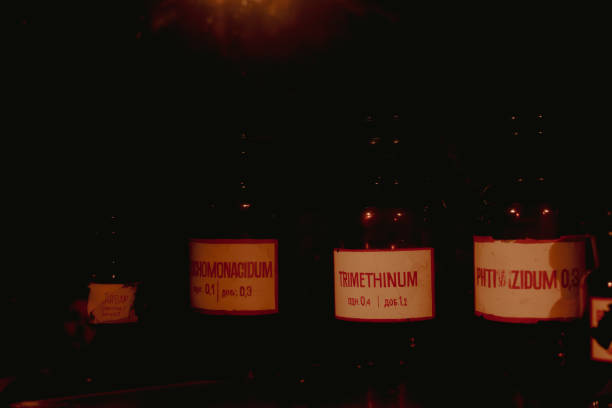 Multiple pharmaceutical liquids on a shelf in an old pharmacy basement