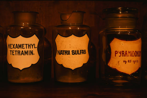 Multiple pharmaceutical liquids on a shelf in an old pharmacy basement