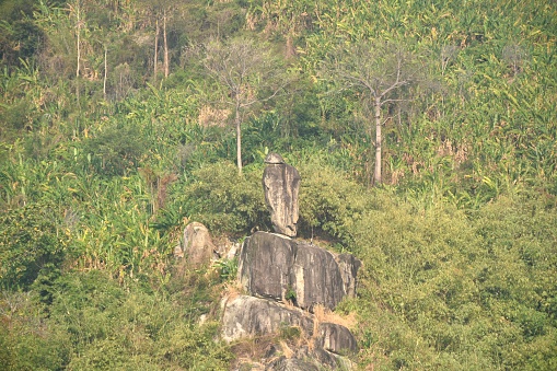 Khao Hua Muak big rock look like wearing hat on mountain in Thailand on sunset