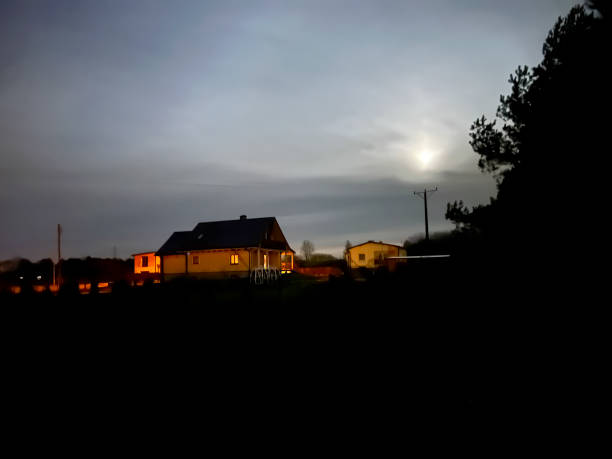 istock A wooden log house visible on a moonlit night 2143598357