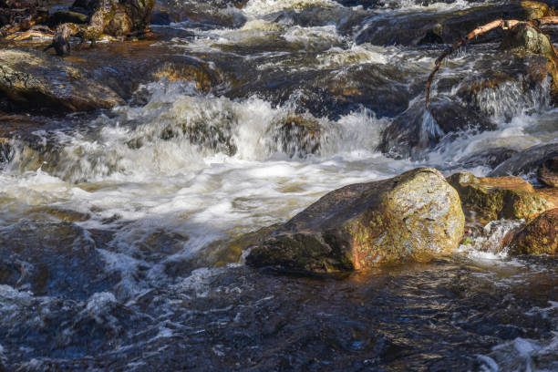 istock water cascading over rocks  at willard  brook 2143618858