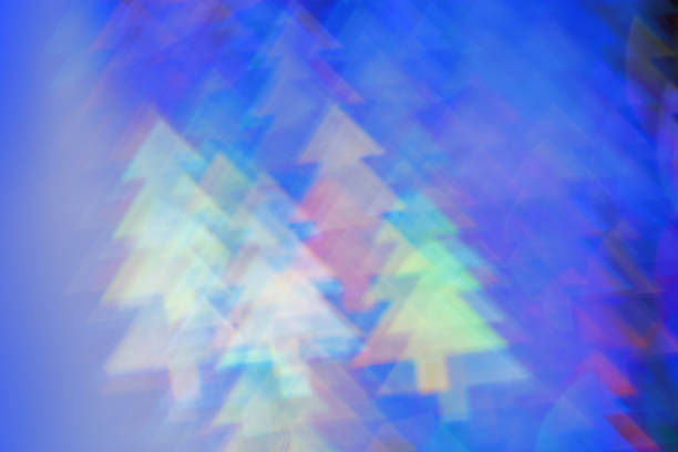 Defocused abstract figured bokeh background, flare from lights as Christmas tree, blurred fir tree bokeh as winter holiday texture. Creative New Year aesthetic textured lighting pattern for festive