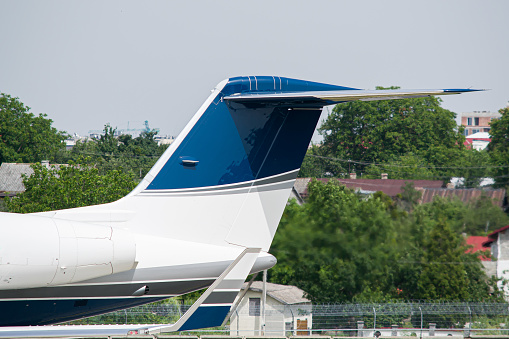 Private VIP aircraft's vertical stabilizer and winglet close-up