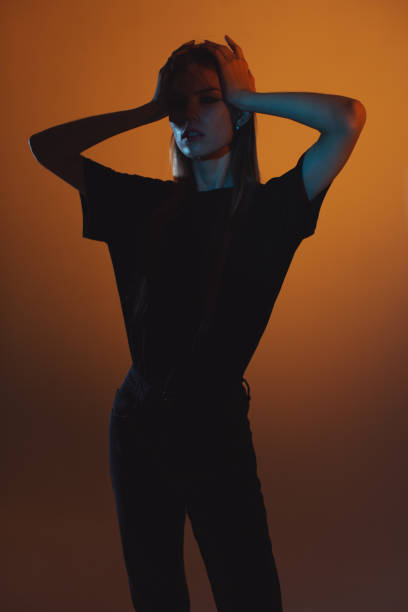 istock Fashion model in studio with neon light. 2143791354