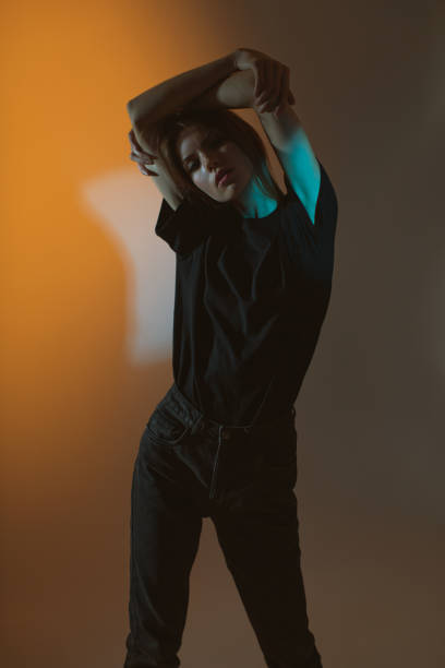 istock Fashion model in studio with neon light. 2143798092