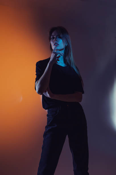 istock Fashion model in studio with neon light. 2143822843