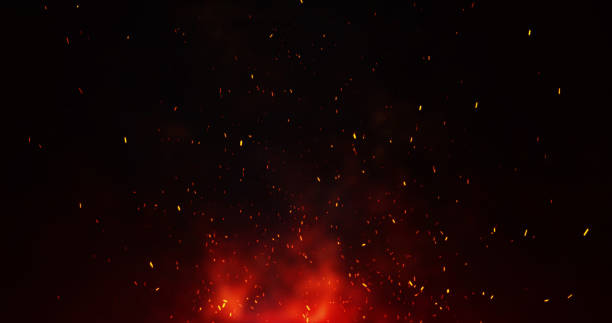 istock Orange sparks of an abstract campfire flying upwards. 2143859689