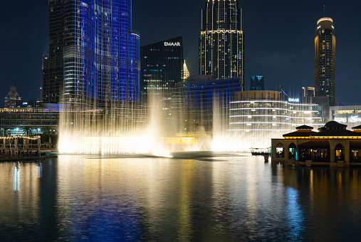 Dubai, United Arab Emirates - November 7, 2023: A picture of the Dubai Fountain light and water show at night.