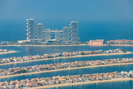 Wooden Bridge Over Water Jumeirah Resort and Burj Al Arab hotel in the background.