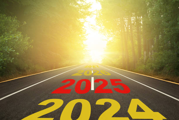 istock The number 2025 written on the forest road 2143900356