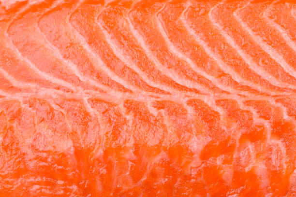 istock Fresh raw salmon steak with spices and herbs prepared for grilled baking 2144008142