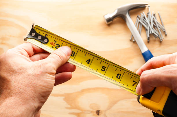 istock Carpenter with measuring tape 2144033760
