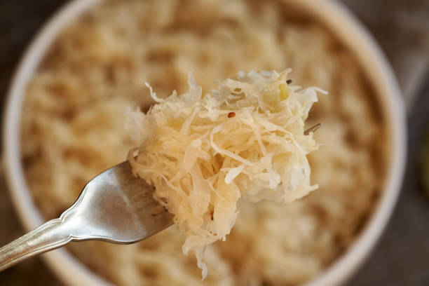 istock Homemade fermented cabbage or sauerkraut on a fork 2144077501