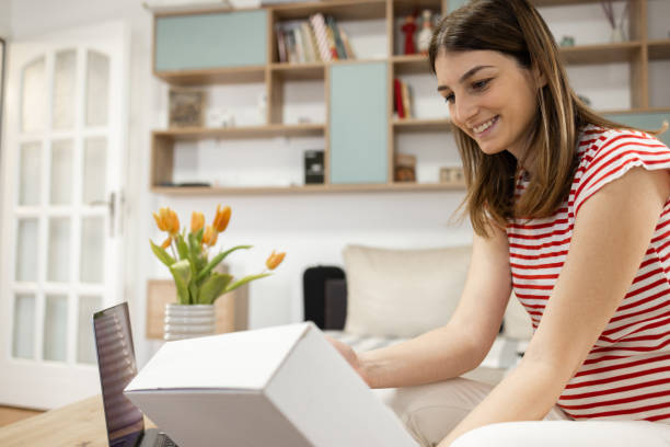 istock Happy woman got a gift delivered 2144100453