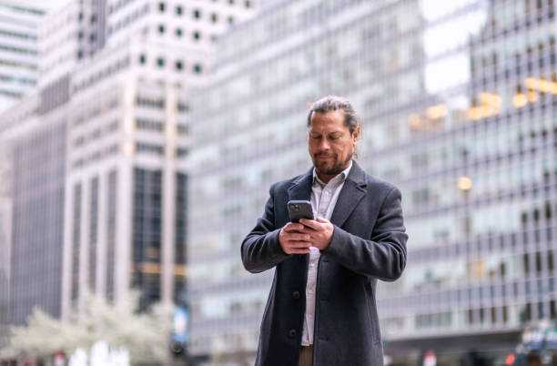 istock Business men using technology in New York City 2144151843