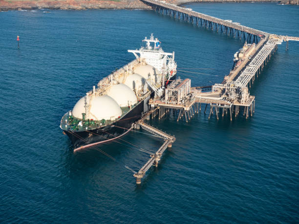Supertanker and jetty from above Moored LPG Supertanker, Dampier ,Western Australia jetty aerial stock pictures, royalty-free photos & images