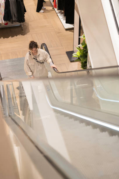 istock woman shopping in a retail store 2144176328